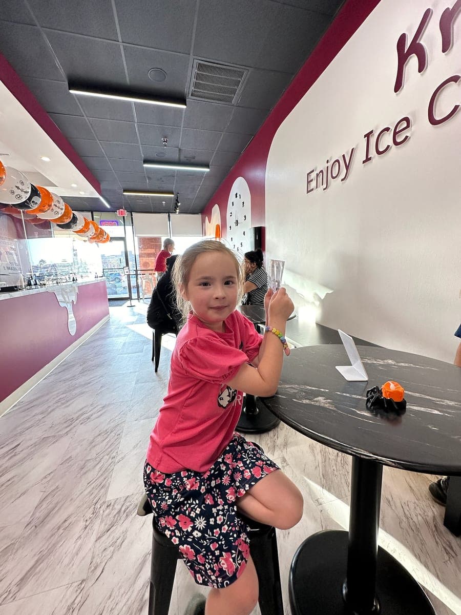 A customer at a table inside Kremee
