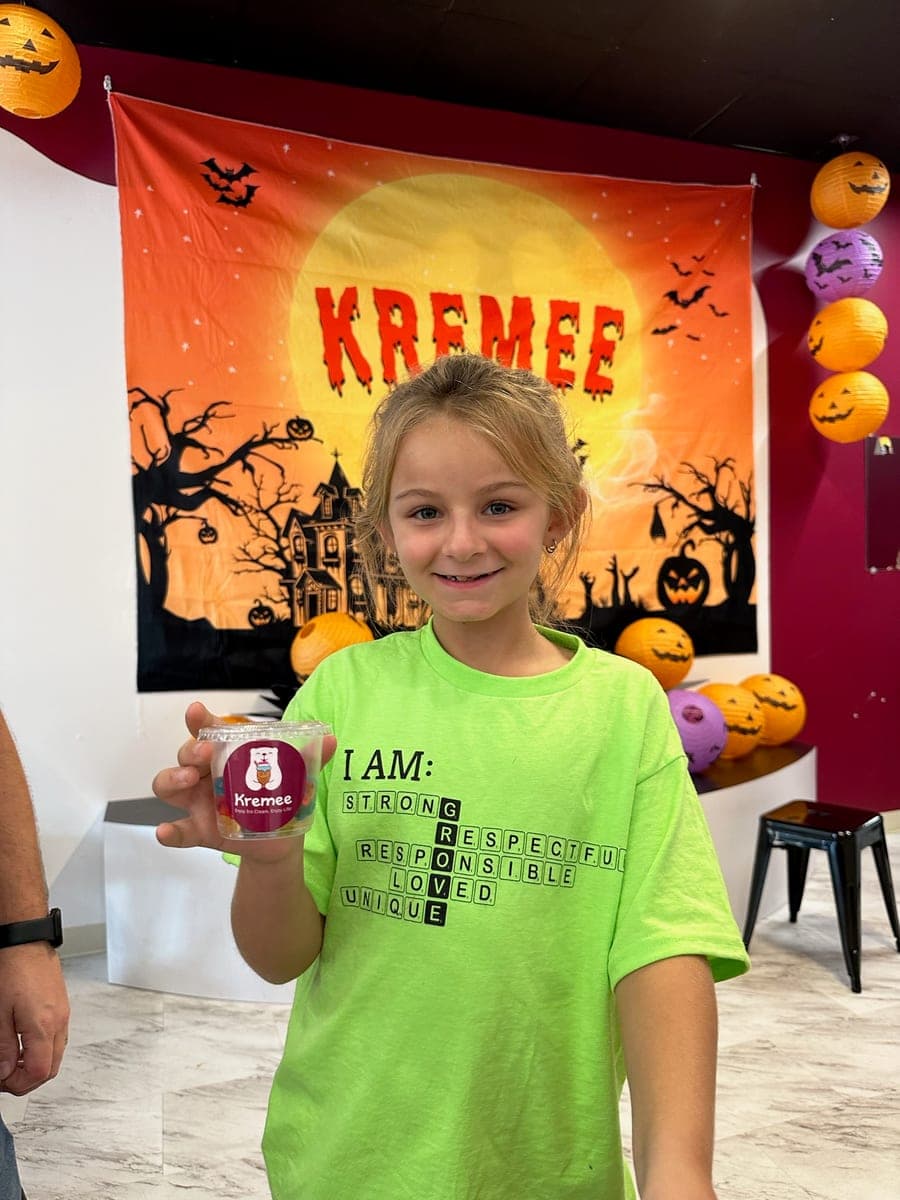 A customer with her ice cream cup at our Halloween event